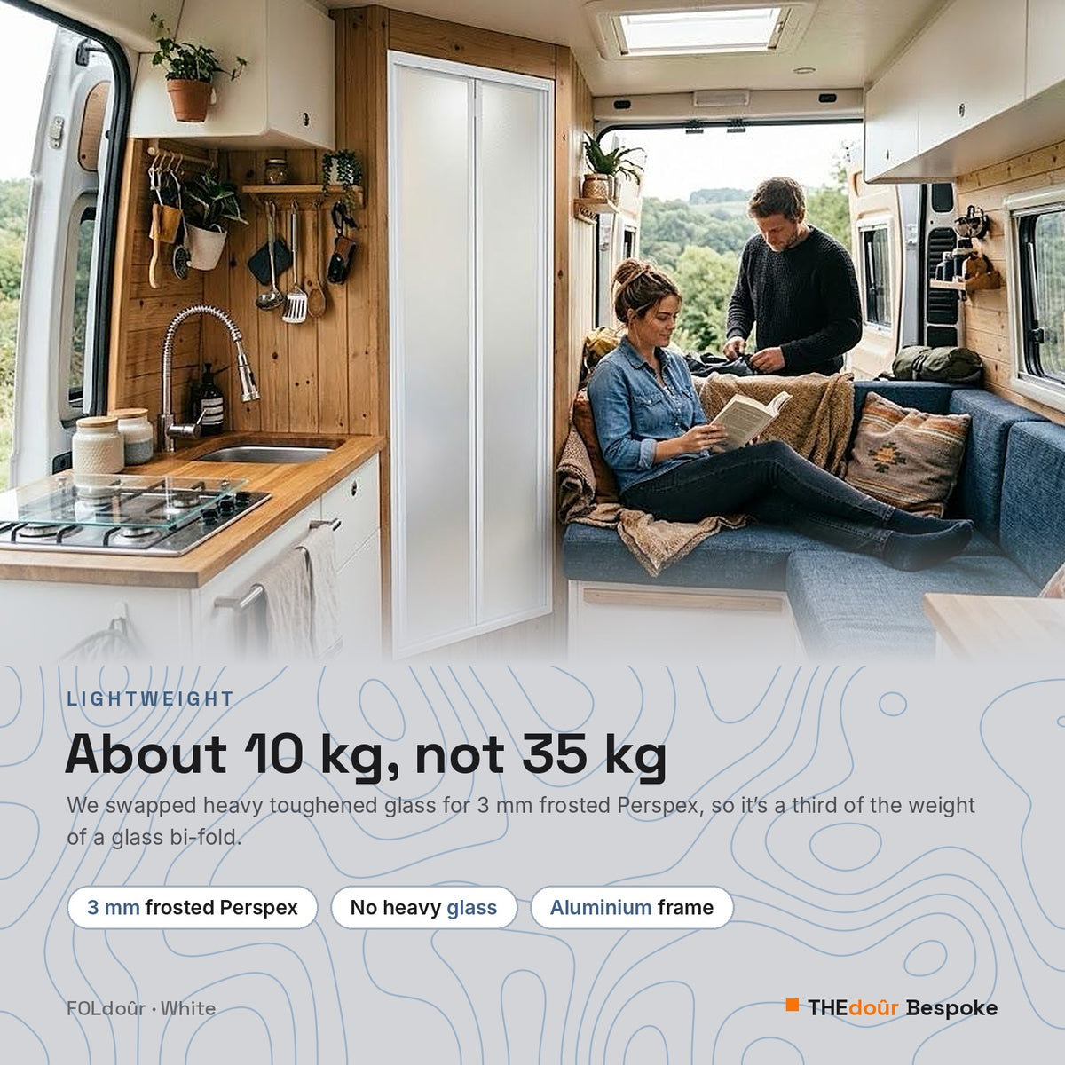 a man and woman sitting on a couch in a van