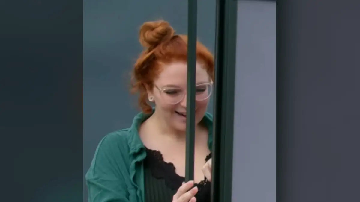 ROLdoûr retractable shower door being opened, as seen on George Clarke's Amazing Spaces: First Home on Channel 4