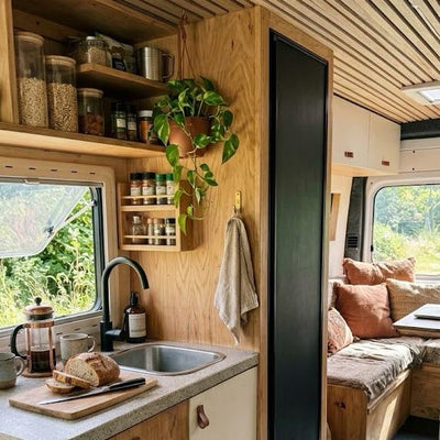 a kitchen with a sink and shelves